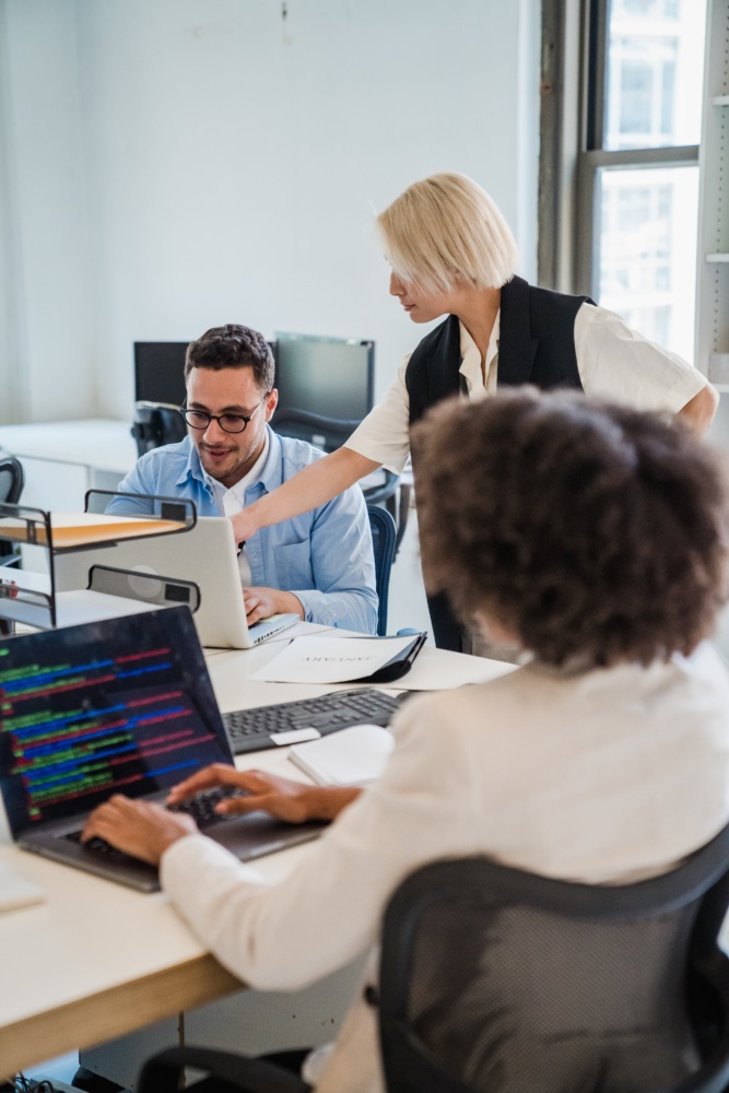 Workers on computers in office